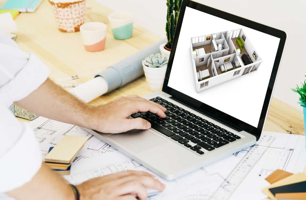 Архітектор працює з ноутбуком cad