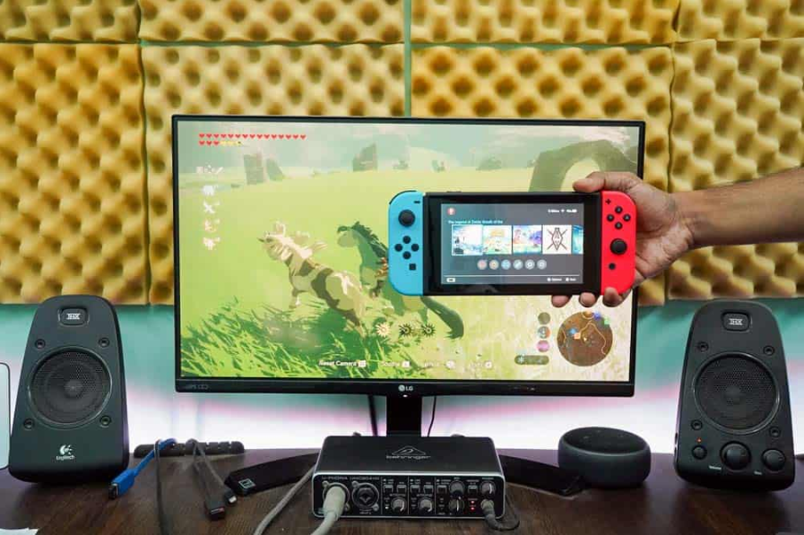 комутатор nintendo показує екран меню, а позаду працює гра nintendo